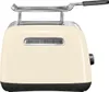 A cream-colored KitchenAid toaster with a chrome rack on top, shown from the back. Produktbild-Vorschau