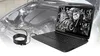 A laptop displaying an engine diagram is placed next to a coiled black cable with a USB connector, with a blurred car engine in the background. Produktbild-Vorschau