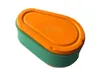 A green and orange air filter on a white background. Anteprima dell’immagine prodotto