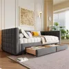 A modern bedroom or living room setting with a daybed, artwork, and plants. Produktbild-Vorschau