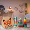 A child's room with a desk, toys, and a clock. Produktbild-Vorschau