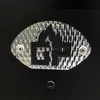 A close-up of a metallic emblem with a flame logo and the letters 'GF' on a black background. Produktbild-Vorschau