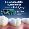 Close-up of teeth with plaque, showing a toothbrush head and bacteria, with German text explaining the consequences of a worn-out brush head. Anteprima dell’immagine prodotto