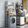 A bathroom or laundry room scene featuring two shelving units above washing machines, stocked with various cleaning and personal care products. Produktbild-Vorschau