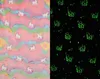 A split image showing a pink, pastel-colored fabric with unicorn patterns on the left, and the same pattern glowing green on a black background on the right. Anteprima dell’immagine prodotto