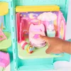 A close-up view of a toy bedroom playset, with a finger interacting with the bed. Náhľad obrázku produktu