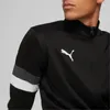 Close-up shot of a man wearing a black Puma tracksuit. Podgląd zdjęcia produktu