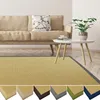 A living room scene with a sofa, coffee table, and a rug. Voir les images du produit