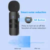 A close-up of a black wireless microphone with a foam windscreen, highlighting its noise reduction feature with a diagram and text. Náhled obrázku produktu