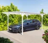 A blue station wagon is parked under a white carport with a green leafy background and a blue sky. Podgląd zdjęcia produktu