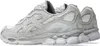 A pair of light grey Asics Gel-NYC sneakers shown from the side. Produktbild-Vorschau
