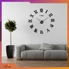A modern living room with a large wall clock, a sofa, and a potted plant. Náhled obrázku produktu