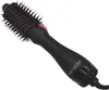 A black Revlon one-step hair dryer and volumizer with pink accents is shown against a white background. Podgląd zdjęcia produktu
