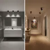 A split image showing a modern bathroom on the left and a hallway with artwork on the right. Produktbild-Vorschau