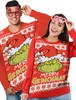 A man and a woman wearing matching Grinch-themed Christmas sweaters. Náhľad obrázku produktu