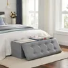 A bedroom scene with a bed and a storage bench at the foot of the bed. Náhled obrázku produktu