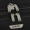 Close-up of luggage zippers and a lock. Produktbild-Vorschau