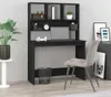 A black desk with shelves in a room, next to a gray chair. Podgląd zdjęcia produktu