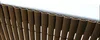 A close-up view of a brown PVC privacy screen fence. Produktbild-Vorschau