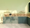 A clean, modern kitchen scene with light green walls and teal cabinets. Podgląd zdjęcia produktu