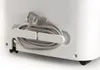 A close-up view of the back of a white appliance, showing a coiled power cord neatly stored on a built-in holder. Produktbild-Vorschau