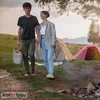 A couple is walking hand-in-hand in a campsite with tents in the background. Náhled obrázku produktu