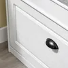 A close-up view of a white drawer with a black handle. Produktbild-Vorschau