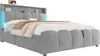 A grey upholstered bed with a headboard featuring storage and LED lighting. Anteprima dell’immagine prodotto