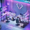 A modern gaming room setup with two L-shaped desks, gaming chairs, computers, and ambient LED lighting. Náhľad obrázku produktu
