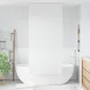 A minimalist bathroom with a freestanding bathtub and a wooden ladder rack with towels. Náhled obrázku produktu