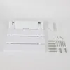 A white folding shower seat and its mounting hardware are laid out on a white background. Voir les images du produit