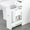 A white bathroom storage unit next to a toilet. Voir les images du produit