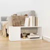 A white storage unit with books and decorative items is placed next to a sofa with a blanket draped over it. Podgląd zdjęcia produktu