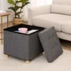 A storage ottoman is shown open with items inside, next to a sofa in a living room setting. Anteprima dell’immagine prodotto