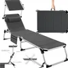 A gray foldable sun lounger with a canopy and side pocket, shown in its unfolded and folded states, along with some accessory diagrams. Náhled obrázku produktu