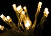 A close-up, blurred image of a string of warm white LED lights against a black background. Náhľad obrázku produktu
