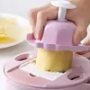 A hand is using a pink vegetable slicer to cut a potato. Náhľad obrázku produktu