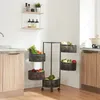 A kitchen scene with a multi-tiered rolling cart filled with fresh produce, placed next to kitchen cabinets and a countertop. Anteprima dell’immagine prodotto