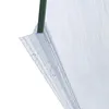 A close-up of a clear plastic shower door seal with water droplets on it, attached to a green frame. Voir les images du produit