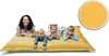 A woman and three children lying on a large yellow beanbag. Produktbild-Vorschau