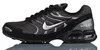 A side view of a black Nike Air Max Torch 4 sneaker against a white background. Voir les images du produit