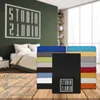 A stack of colorful bed sheets is displayed in front of a bedroom scene, with icons and text highlighting product features. Produktbild-Vorschau