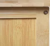 A close-up view of the corner of a wooden cabinet, showing the texture and construction. Podgląd zdjęcia produktu