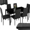 A black dining table with six black chairs and a vase with flowers on the table. Náhled obrázku produktu