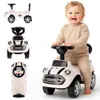 A baby is riding a white toy car, with other views of the toy car shown in smaller images. Náhled obrázku produktu
