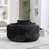 A black bean bag chair with cushions in a living room setting. Podgląd zdjęcia produktu