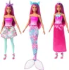 Three Barbie dolls in different fantasy outfits. Produktbild-Vorschau