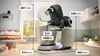 A kitchen mixer with dimensions indicated by lines and text, placed on a countertop next to a cake. Produktbild-Vorschau