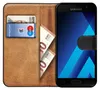 A book-style phone case with slots for cards and cash, displaying a Samsung smartphone. Anteprima dell’immagine prodotto