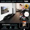 A woman is using an indoor cycling bike in a modern room, with a large screen displaying a virtual cycling route and various app logos. Produktbild-Vorschau